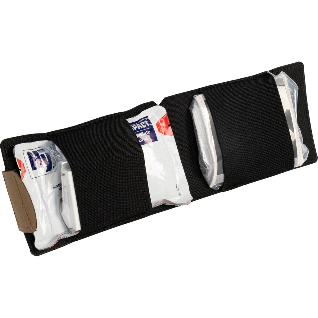 Open EDC medical wallet showing pocket trauma kit contents including HyFin Vent chest seals, wound packing gauze and elastic wrap