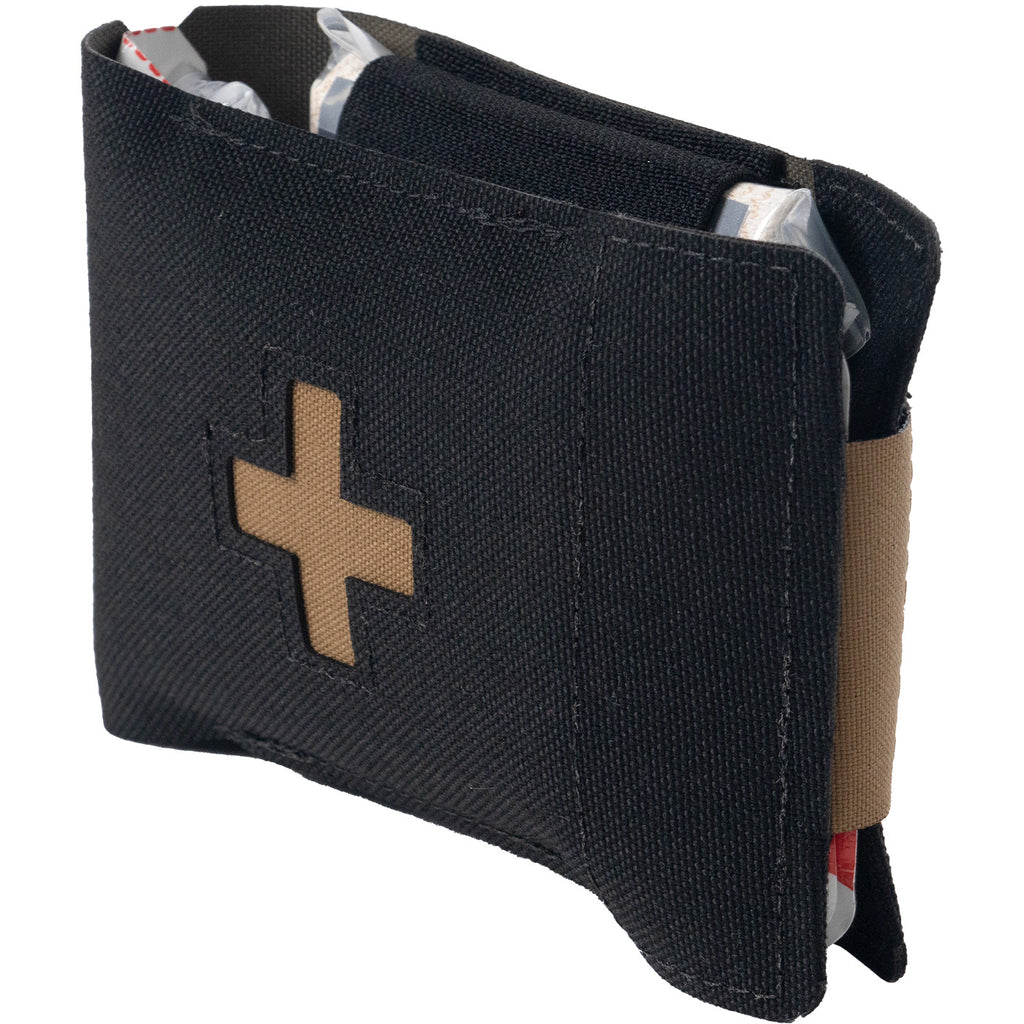 Partially open North American Rescue EDC medical wallet kit showing concealed trauma supplies and tan medical cross patch