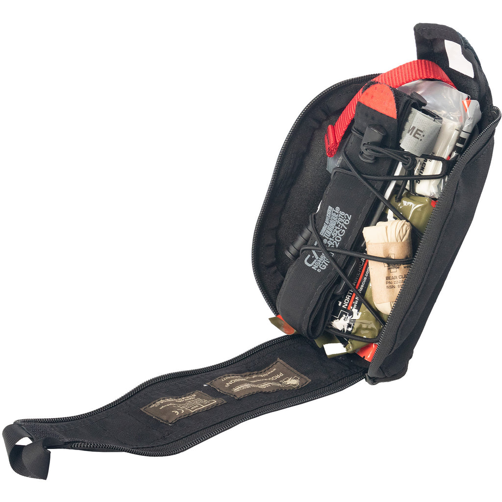 Angled view of open Eagle IFAK pouch showing packed tactical trauma kit with C-A-T tourniquet, gauze, pressure dressing, gloves, and emergency medical supplies
